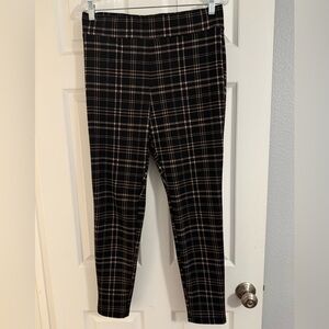 Loft black and tan leggings.